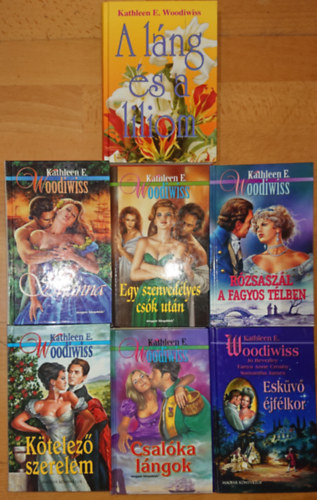 Kathleen E. Woodiwiss - 7 k�nyv Kathleen E. Woodiwisst�l: Egy szenved�lyes  cs�k ut�n, R�zsasz�l a fagyos t�lben, L�ng �s Liliom, K�telez� szerelem, Csal�ka l�ngok, Esk�v� �jf�lkor, Shanna