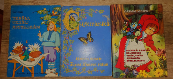 Grimm testv�rek - 5 Grimm-mese h�rom kiadv�nyban: Ter�lj, ter�lj asztalk�m, Csipker�zsika, Piroska �s a farkas, Hamupip�ke, H�velyk Matyi